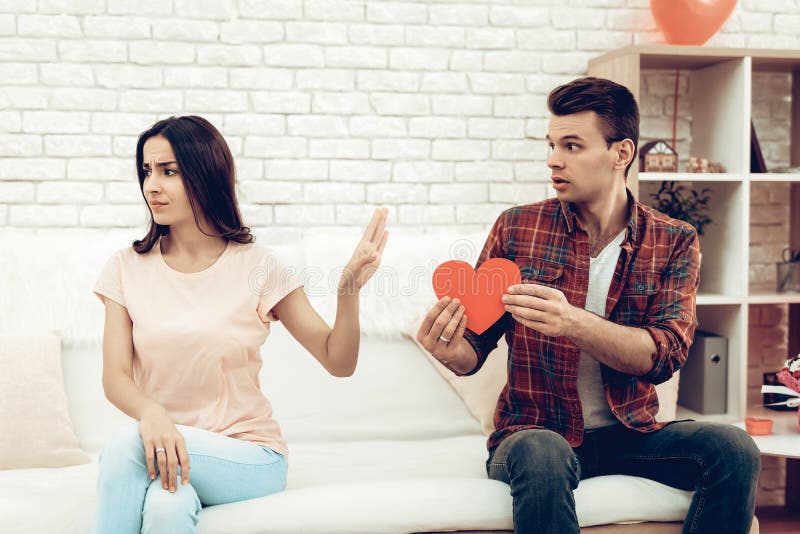 The Girl Refuses Boyfriend On Valentine`s Day. royalty free stock image The Girl Refuses Boyfriend On Valentine`s Day. royalty free stock image