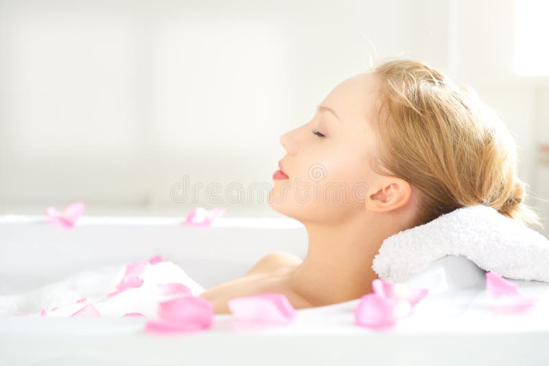 Girl relaxing in bathtub