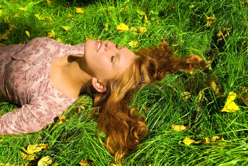 Girl is relaxing on the grass