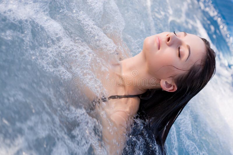 Girl relaxing in Jacuzzi