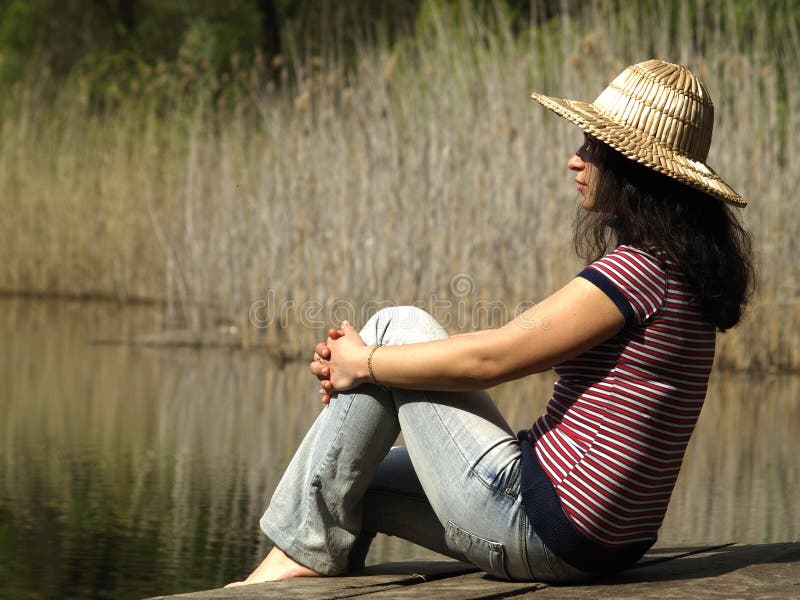 Girl resting near lake