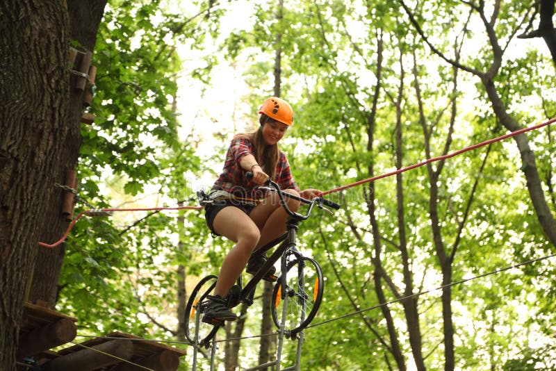 Girl Riding Bicycle On Tightrope Editorial Image Image 21830750