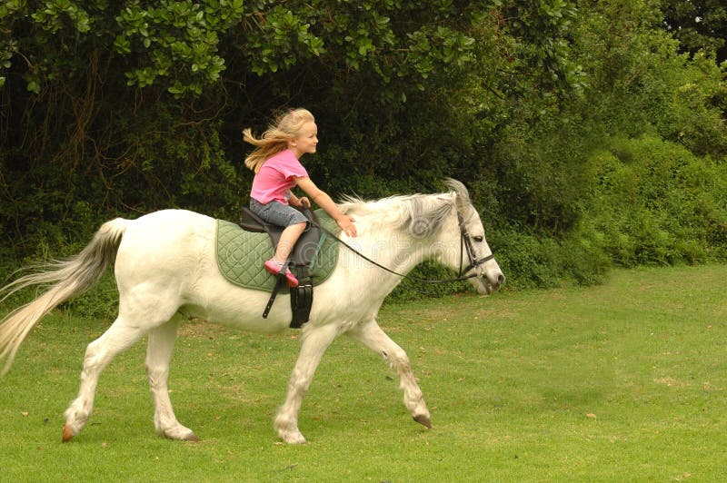 Girl riding her pony royalty free stock images Girl riding her pony royalty free stock images