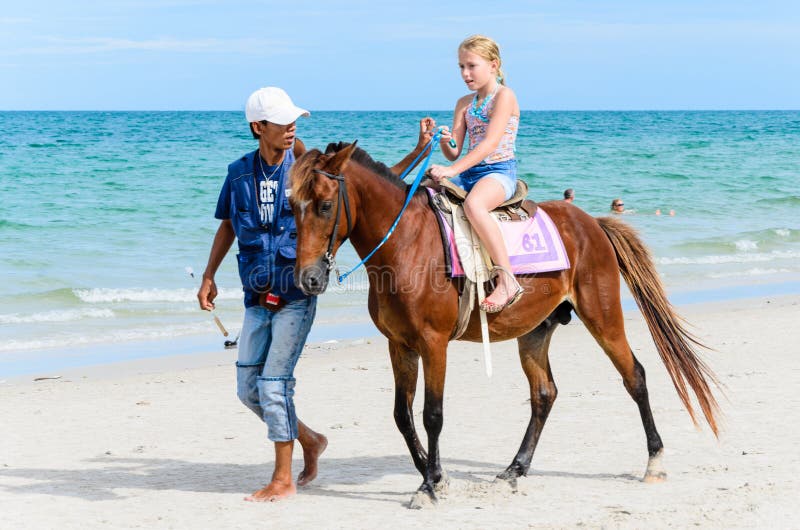 Girl riding horse.