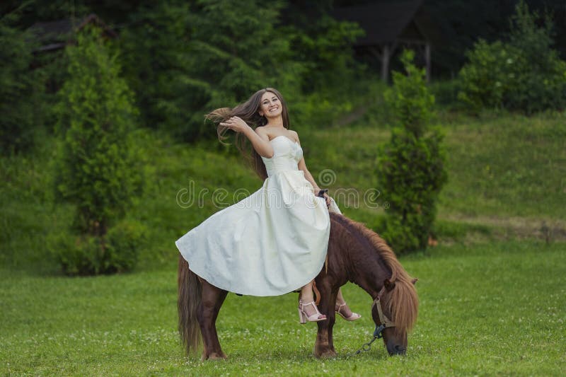 girl riding a pony