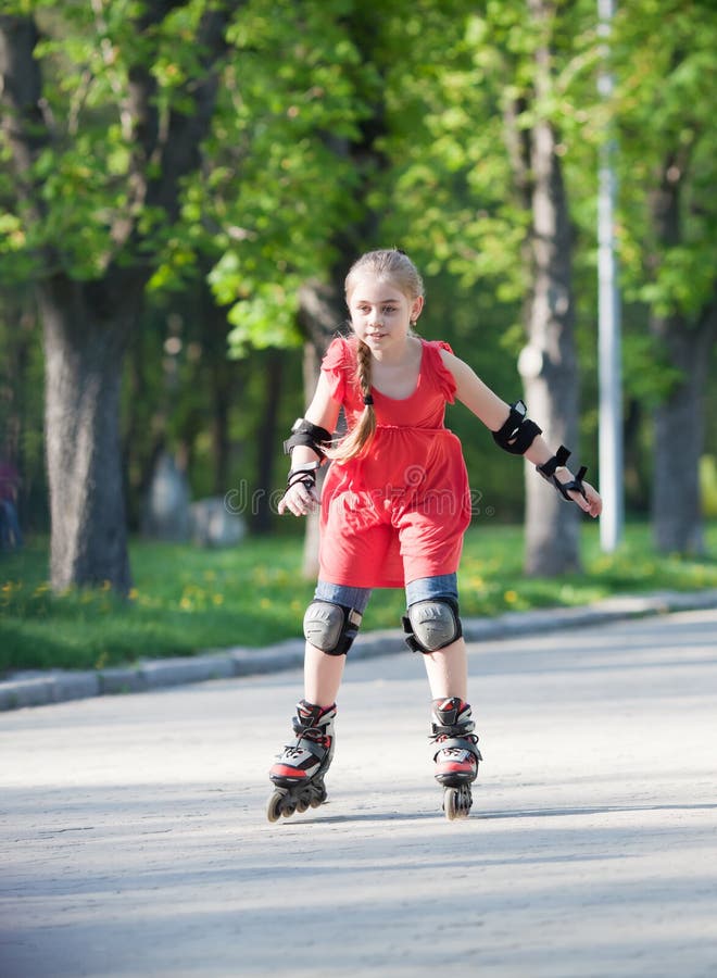 Girl on rollerblades stock photo. Image of leisure, road 25055688