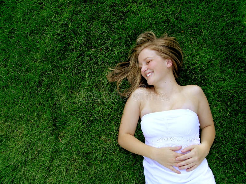 Girl Rolling in Grass