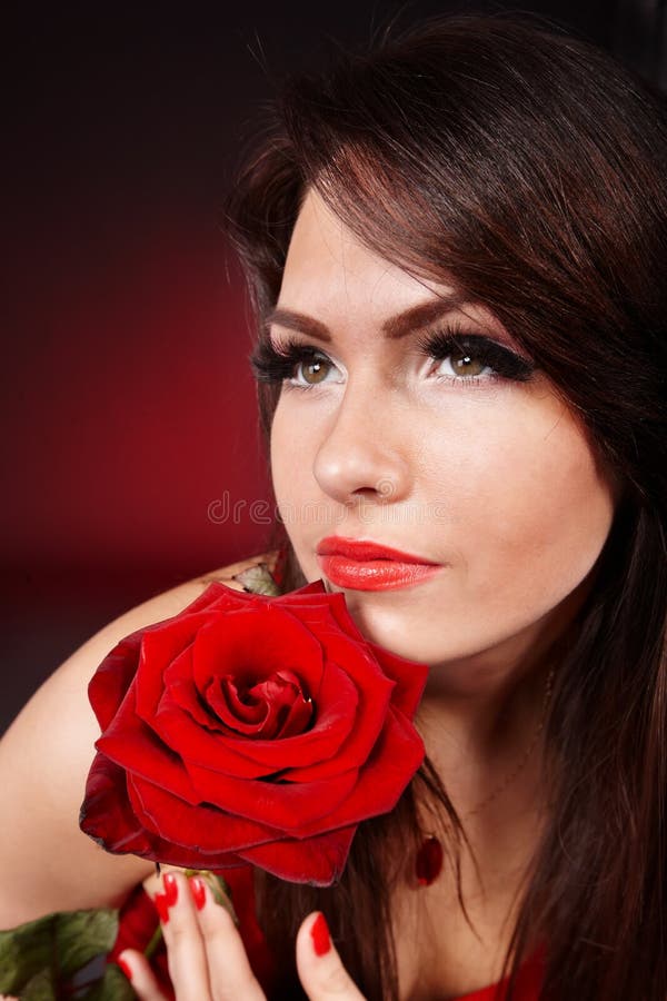 Girl with Rose on Red Background. Stock Photo Image of beautiful