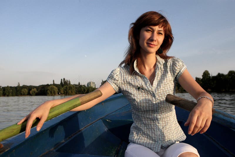 Girl rowing a boat