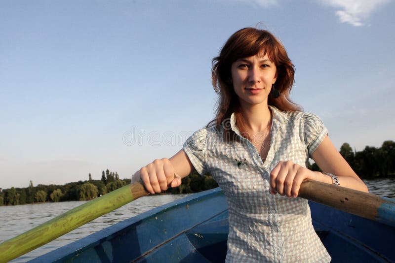 Girl rowing a boat