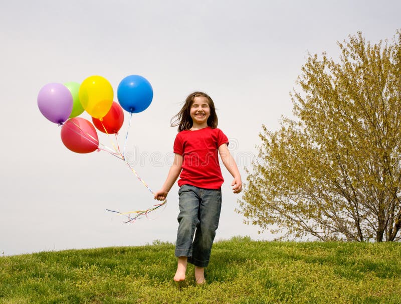 Girl Running With Balloons stock images Girl Running With Balloons stock images