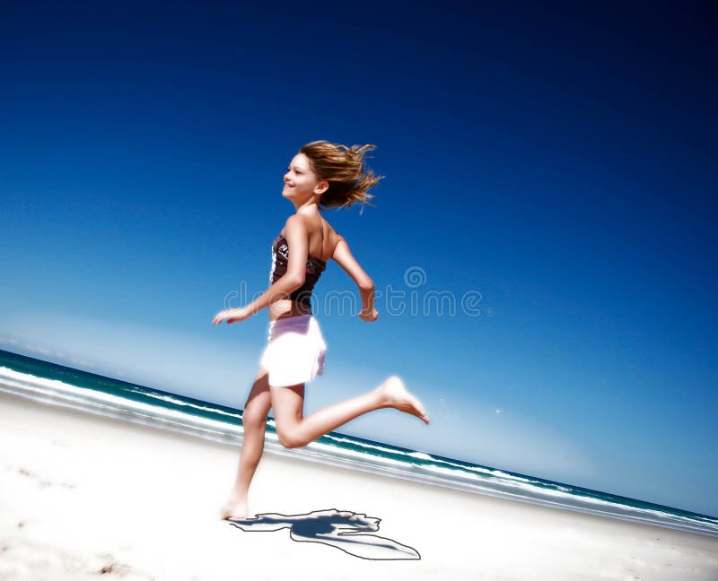 Girl running down the beach