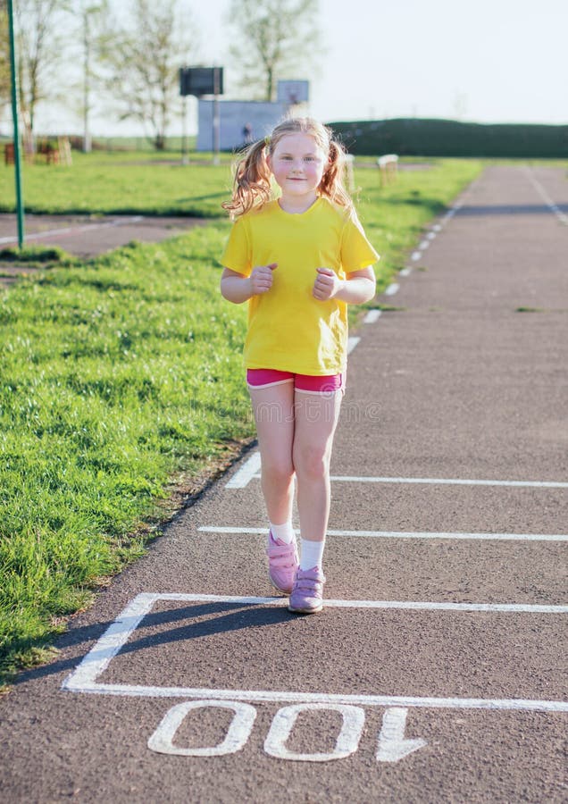 Girl running on track stock photo. Image of child, youth 35122442