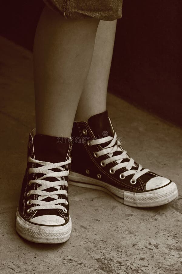 Girl S Feet In Converse Sneakers Stock 