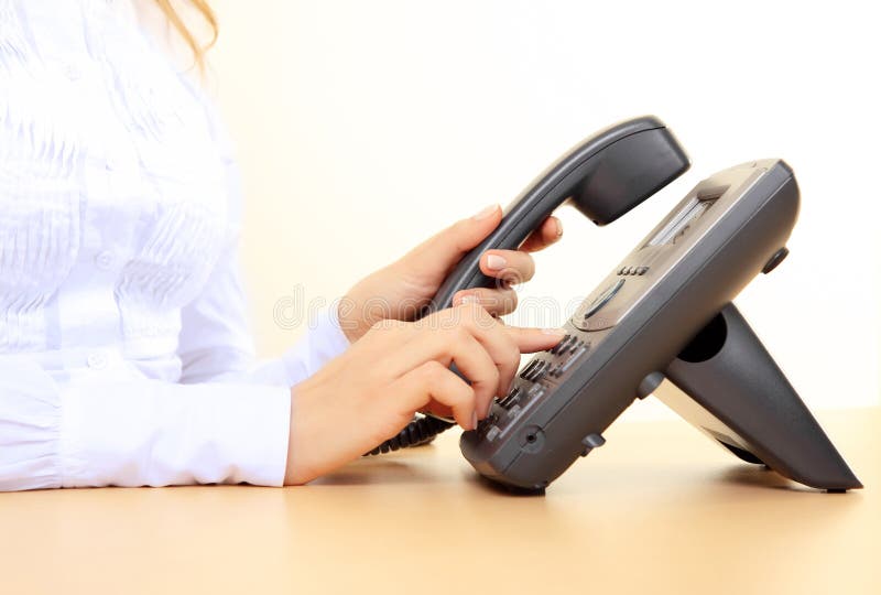 Girl's hands dialing a number royalty free stock photos