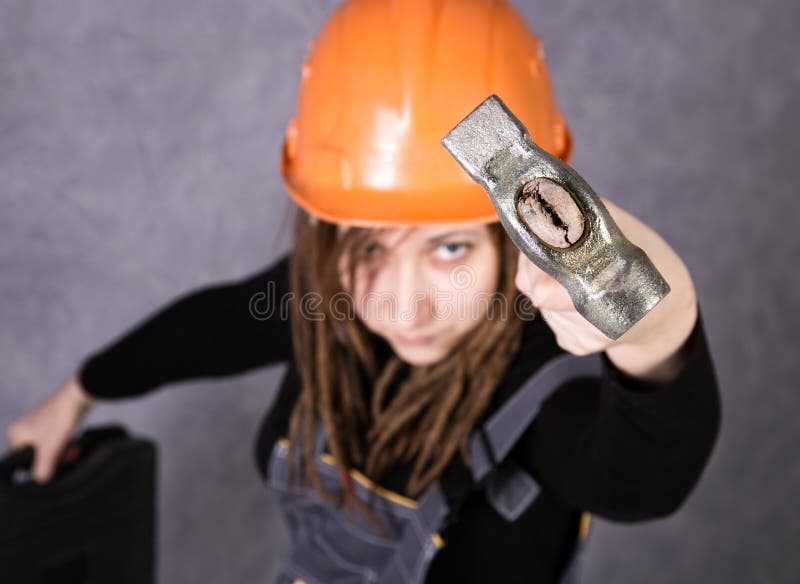 Girl In Safety Helmet Orange Vest Holding Hammer Tool Stock Image