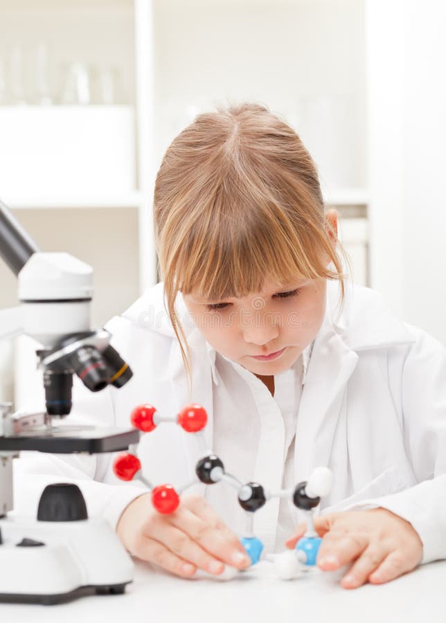 Girl in school lab stock images