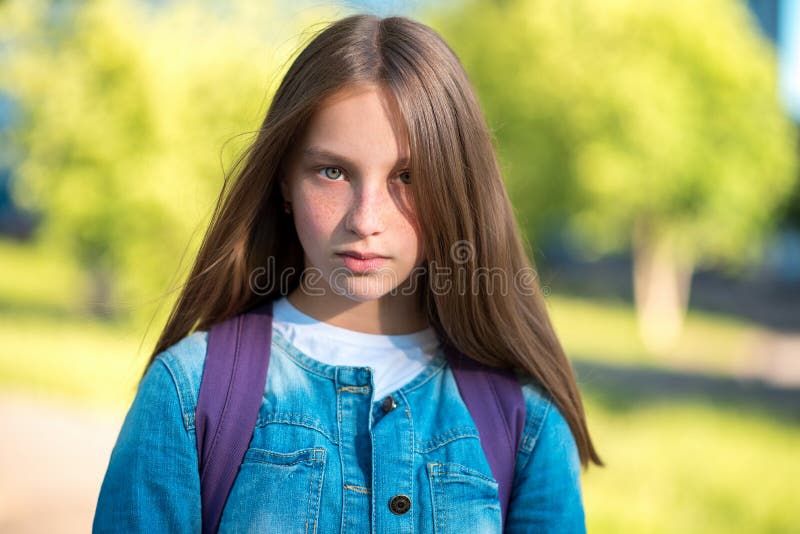 Close Up Portrait Girl Schoolgirl In A Denim Jacket Behind Backpack Long Hair Freckles On