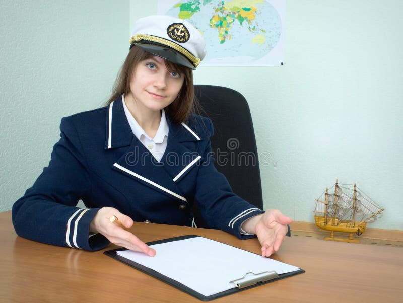 Girl - sea captain with the tablet royalty free stock photo