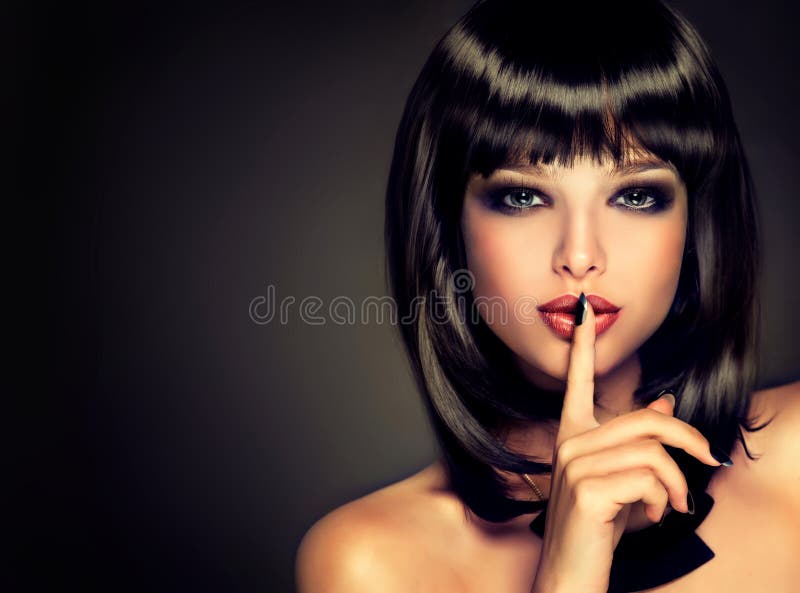 The girl with a secret . Model brunette with hairstyle of the care.