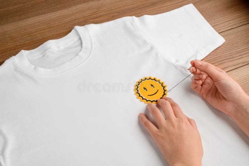 Girl Sewing Patches on T-shirt. Stock Image - Image of creative