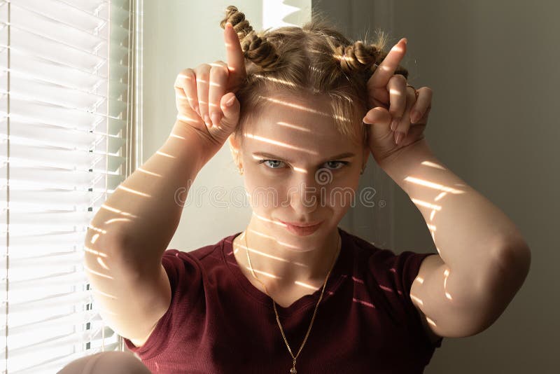 Girl show horns royalty free stock photography Girl show horns royalty free stock photography
