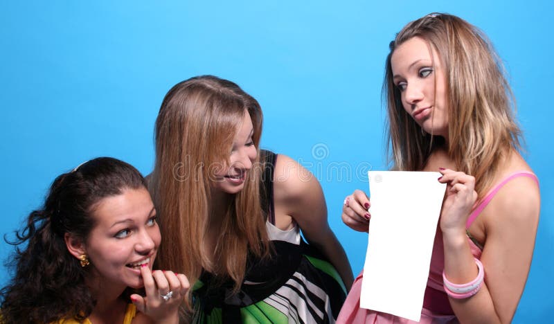 A girl showing to her friends a list of paper