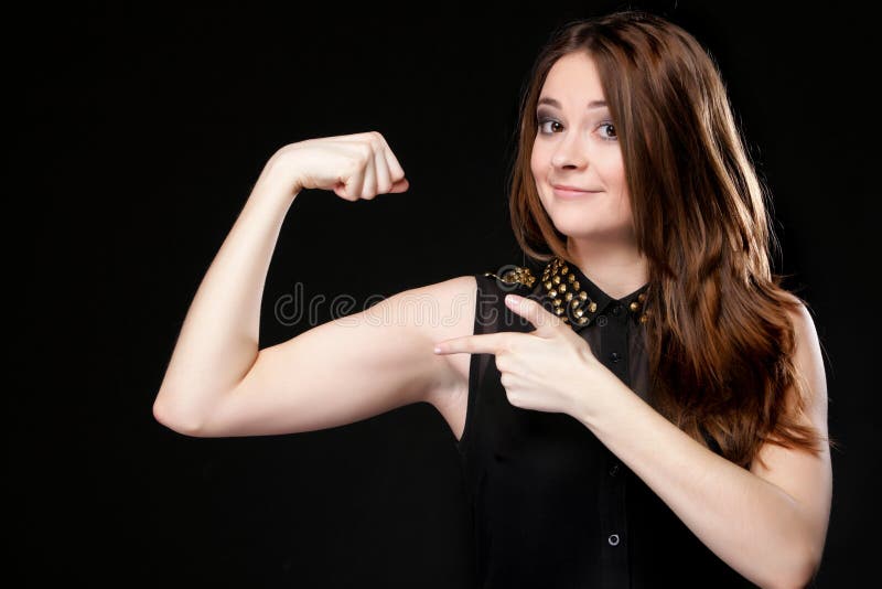 Girl shows her muscles strength and power