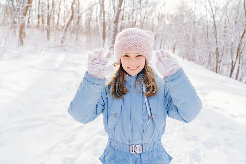 A Girl Shows Snow Sticking To Pink Gloves after Playing in Snowballs ...