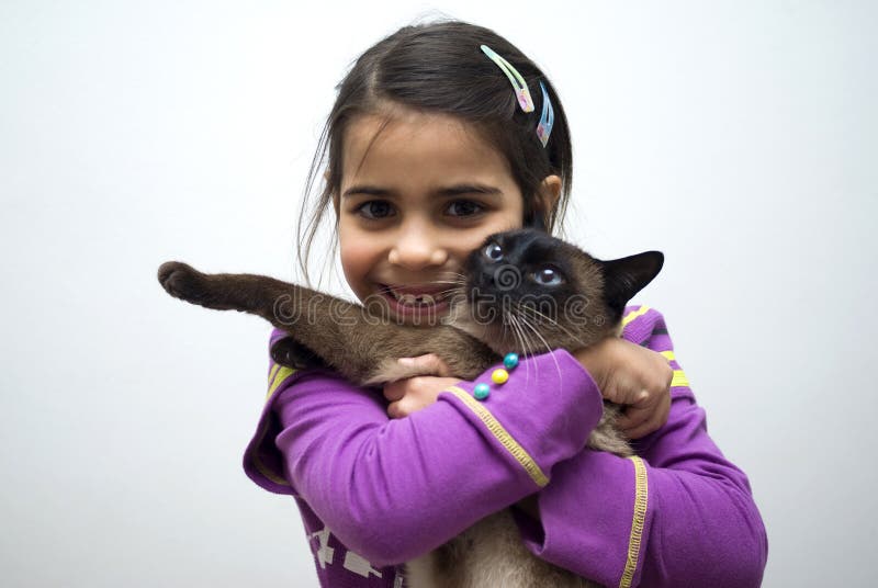 Girl with siamese cat stock image. Image of innocent 22599863