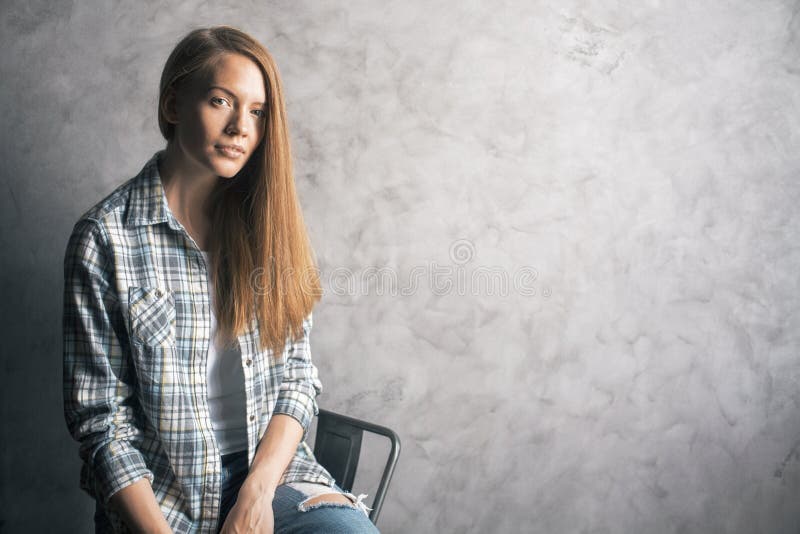 Girl Sitting Against Blank Wall Stock Photo Image Of Female Gray