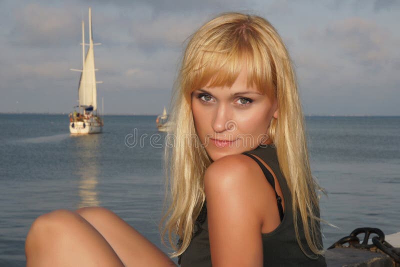 Girl sitting on the beach