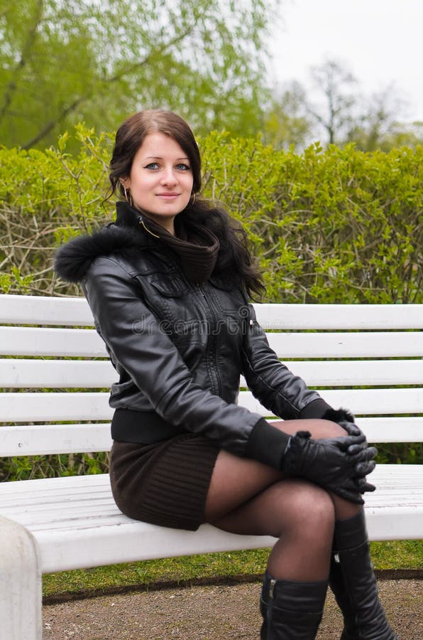 Girl sitting on bench stock photo. Image of attractive - 24751486