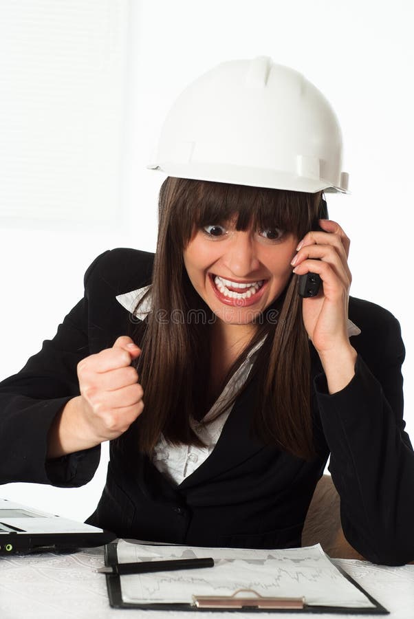 Girl sitting in the construction helmet