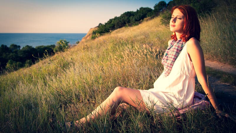 Girl at hill in sunrise.