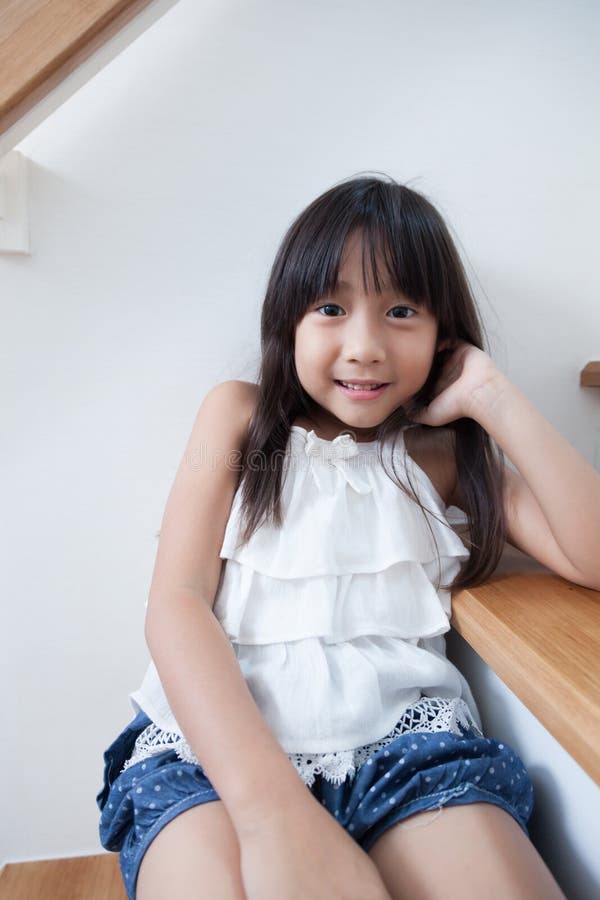 Girl sitting in on the ladder