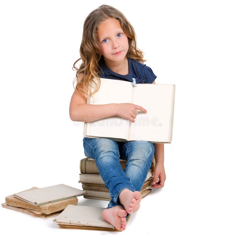 Girl sitting on pile of old books.