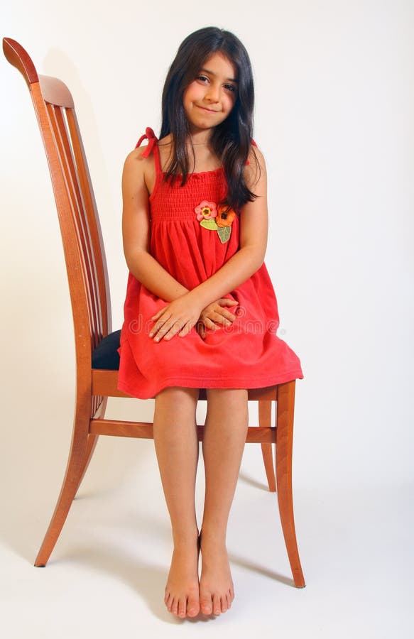 Girl sitting in red dress