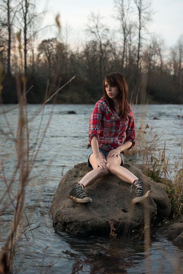 Girl Sitting on a River Rock Stock Image - Image of beautiful, rocks ...