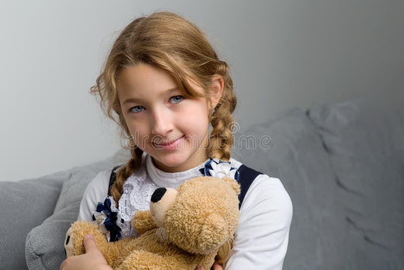 Girl Sitting on Sofa Hugging Teddy Bear Stock Image - Image of beauty ...