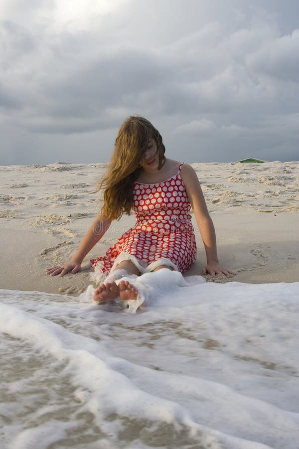 Girl Sitting in Surf