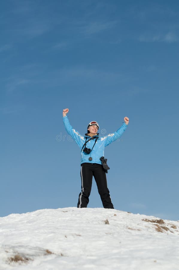 Girl skier on the mountain peak