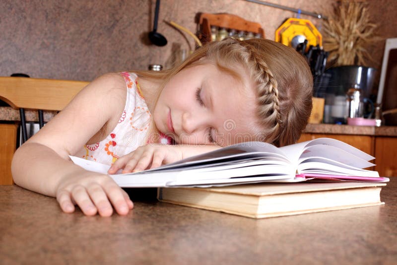 Girl sleep at books