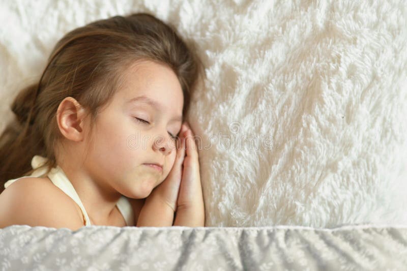 Girl sleeping in bed stock photo. Image of adorable - 106628802
