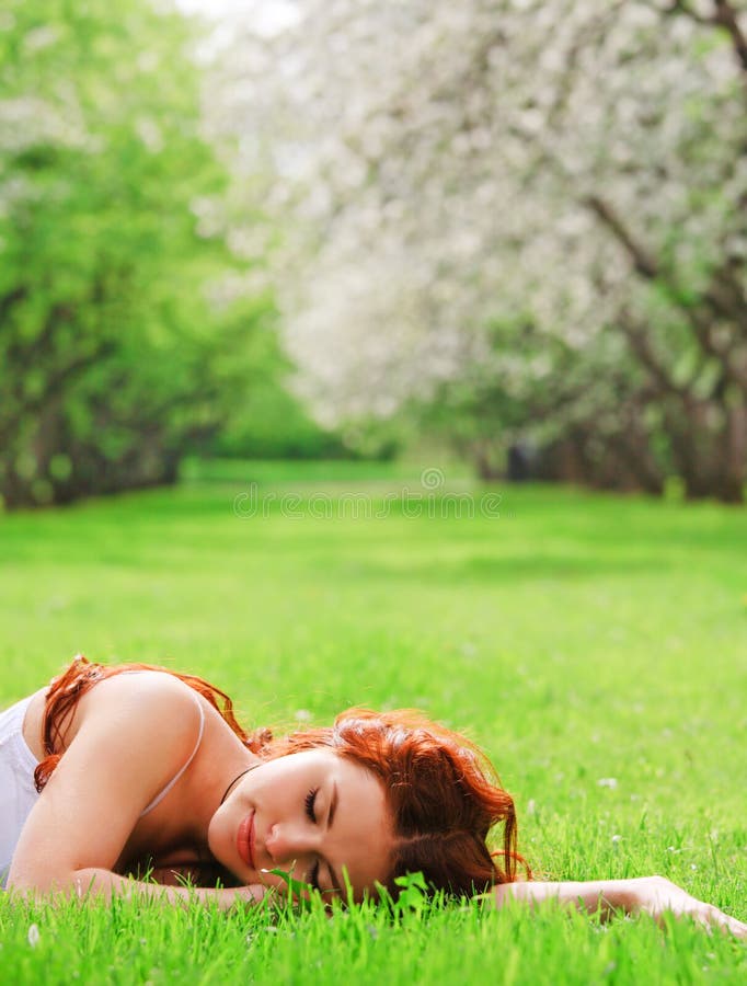 Girl sleeping in grass