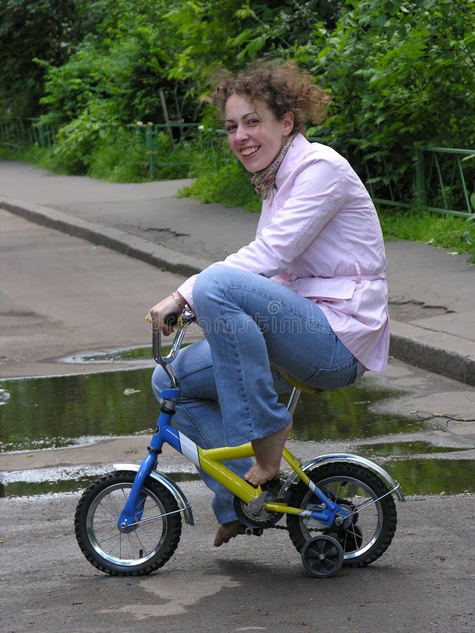 Girl on small bicycle