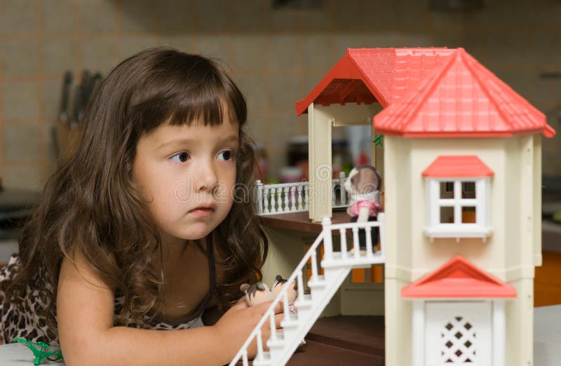 The Girl with a Small House for Dolls Stock Image Image of doll, eyes