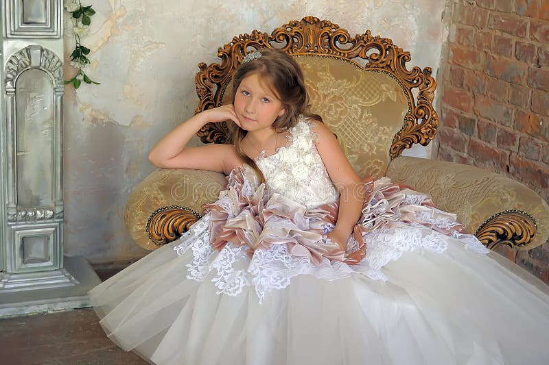 Girl in a Smart Ball Gown Sitting in a Large Armchair Stock Image ...