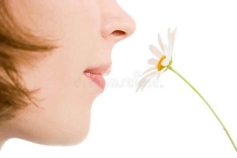 Girl smelling a flower