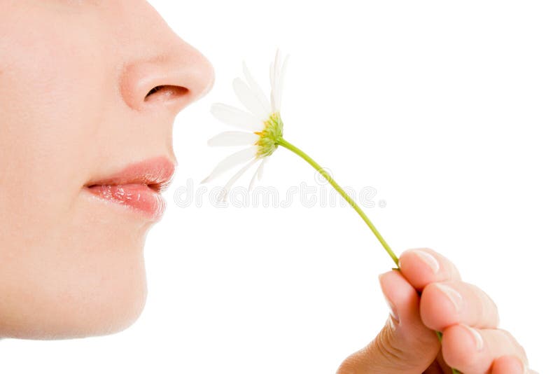 Girl smelling a flower